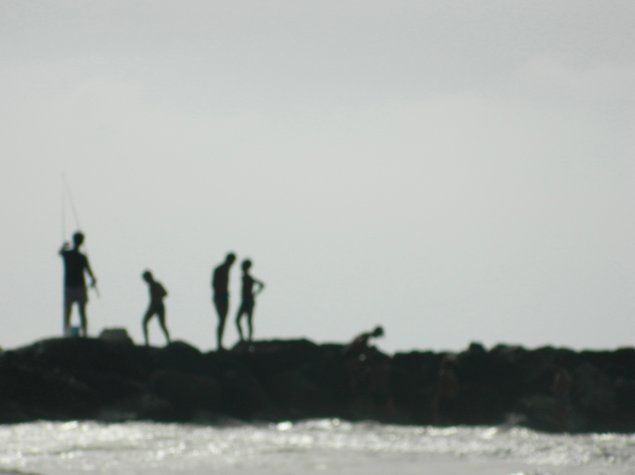 Fishermen at Donnalucata beach Road Trip in Sicily