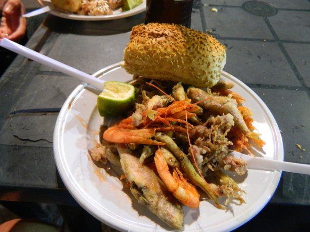 fresh fried sea street food at Vucciria market Road trip in Sicily